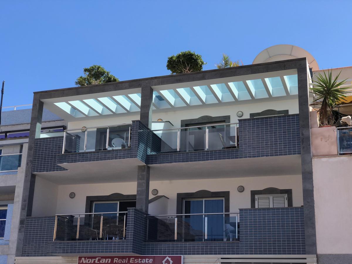 Billy'S Beachfront Apartment With Pool Access بويرتو دي موغان المظهر الخارجي الصورة